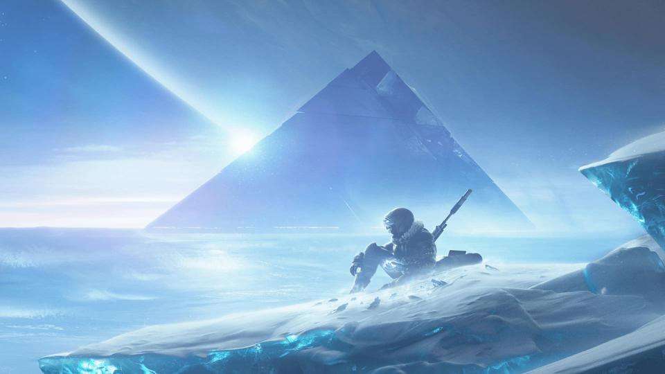 Hunter sitting on ice with pyramid in the background